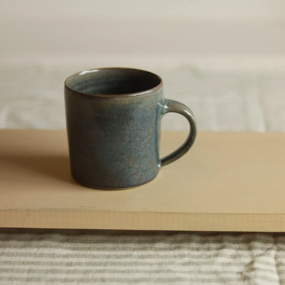 A blue ceramic mug, undamaged